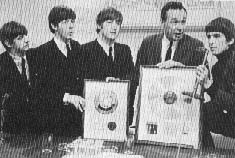 Picking up their Gold Records in 1964