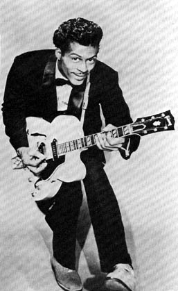 Chuck Berry does his "duck walk"