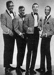 The Miracles (Smokey Robinson, 2nd from right)